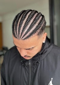 a man with braids in his hair