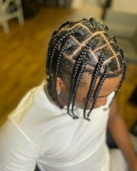 a man with braids in his hair